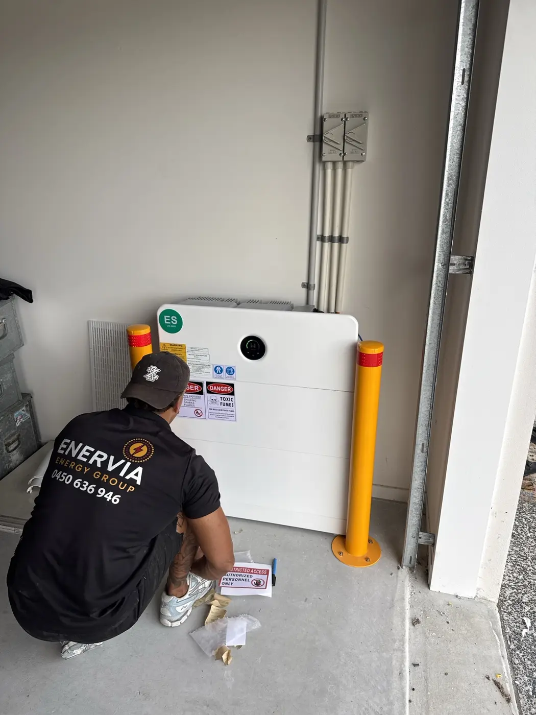 Enervia electrician installing a home battery